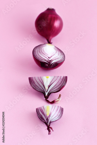 Purple onion on a light pink background