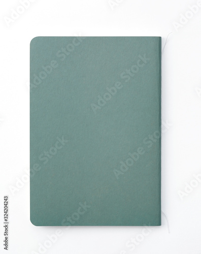 Top view of closed stitch blank recycled paper cover notebook on white background.