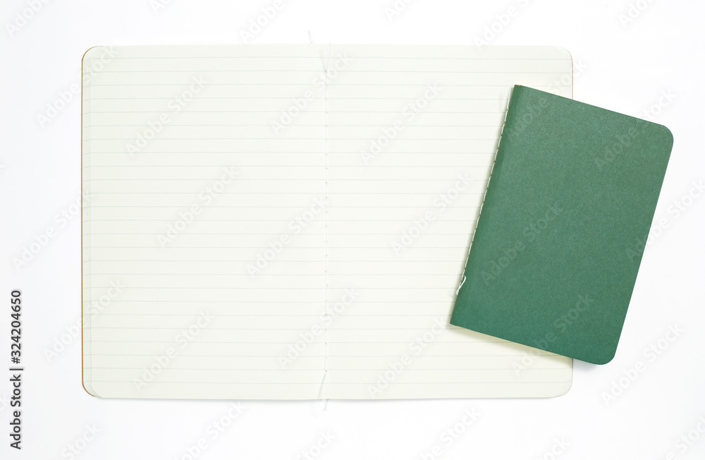 Fototapeta premium Top view of open stitch blank recycled paper cover notebook on white background.