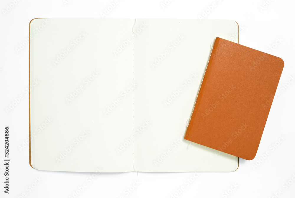 Top view of open stitch blank recycled paper cover notebook on white background. Top view of open stitch blank recycled paper cover notebook on white background.