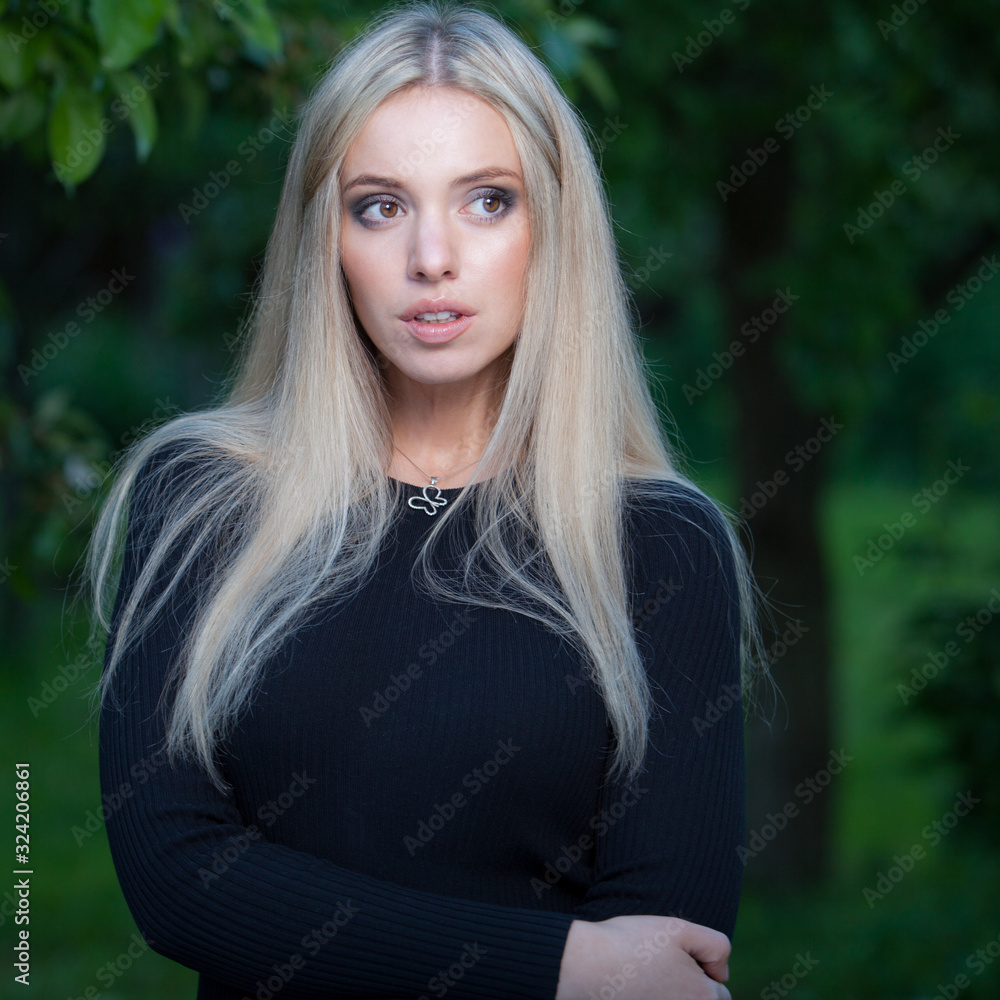 Portrait of beautiful young girl in summer garden. Portrait of beautiful young girl in summer garden.