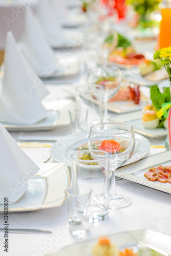 Served table with different dishes and drinks © Canvas Alchemy
