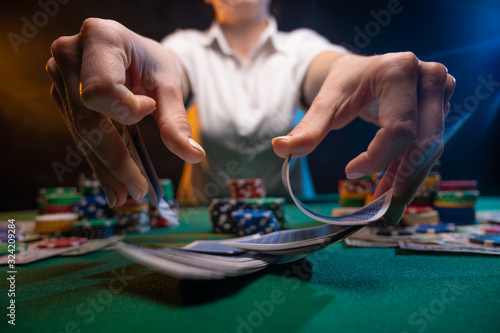 Poker. Playing cards in a casino. Dealer deals cards. Successful game. Online casino advertising.