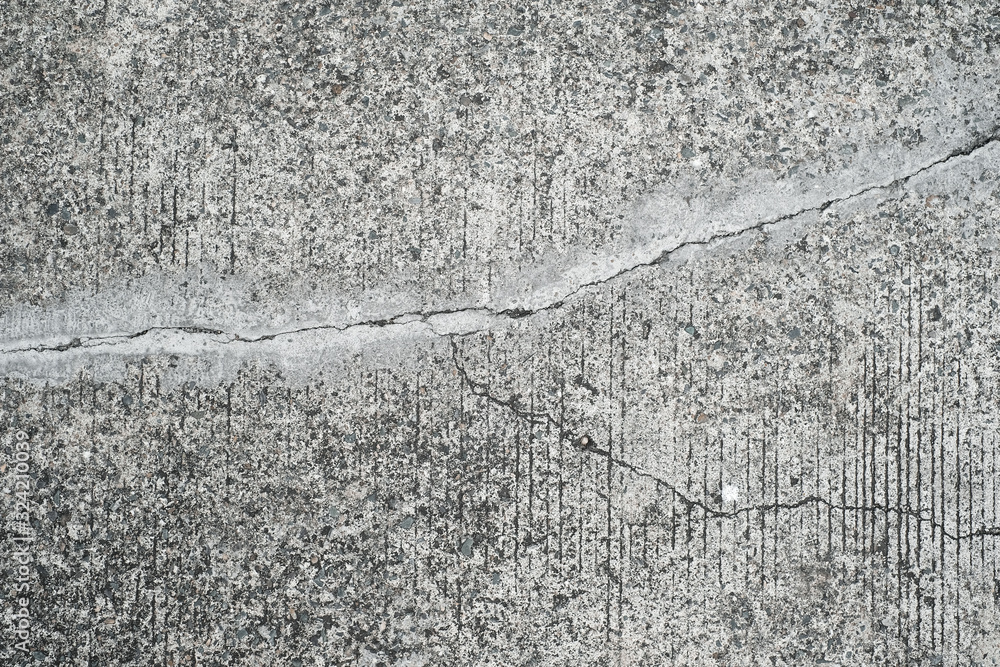 Naklejka premium cracked concrete floor texture - old road