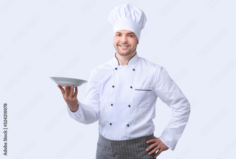 Chef Man Posing With Plate Smiling To Camera, Studio Shot Chef Man Posing With Plate Smiling To Camera, Studio Shot