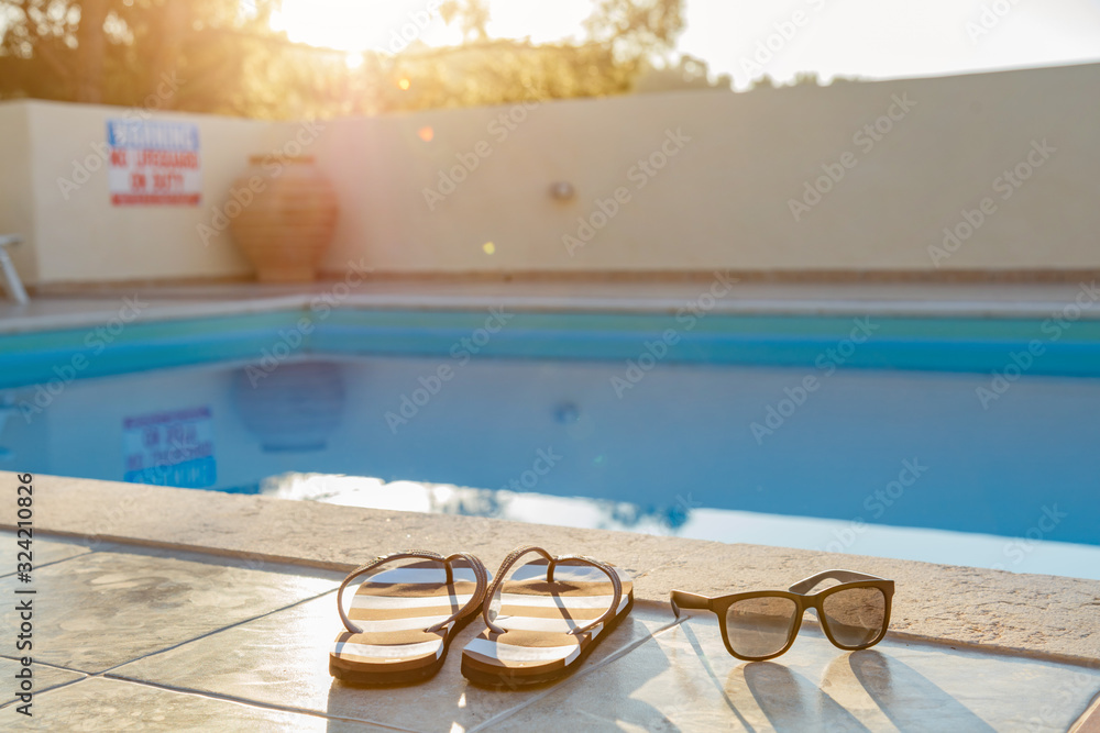Obraz premium Tropical swimming pool on a nice hot day.