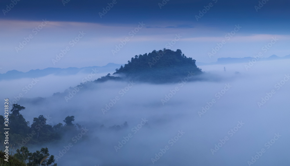 view morning of Peak mountain around with sea of mist with cloudy sky background, Khao Sok National Park, Surat Thani, southern Thailand.
