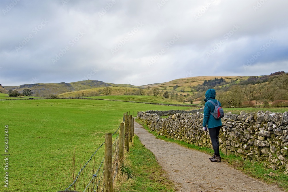 Hiker on route to Janet's Foss, from Malham village, Yorkshire Dales.