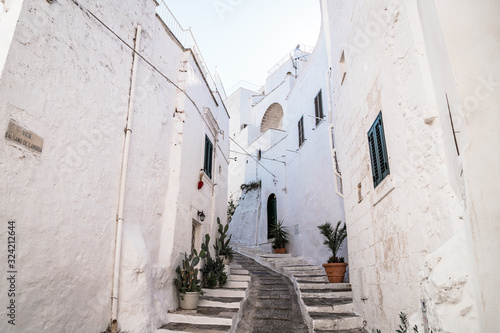Historic center of white city of Ostuni in Puglia, in a day of August © Jan Cattaneo