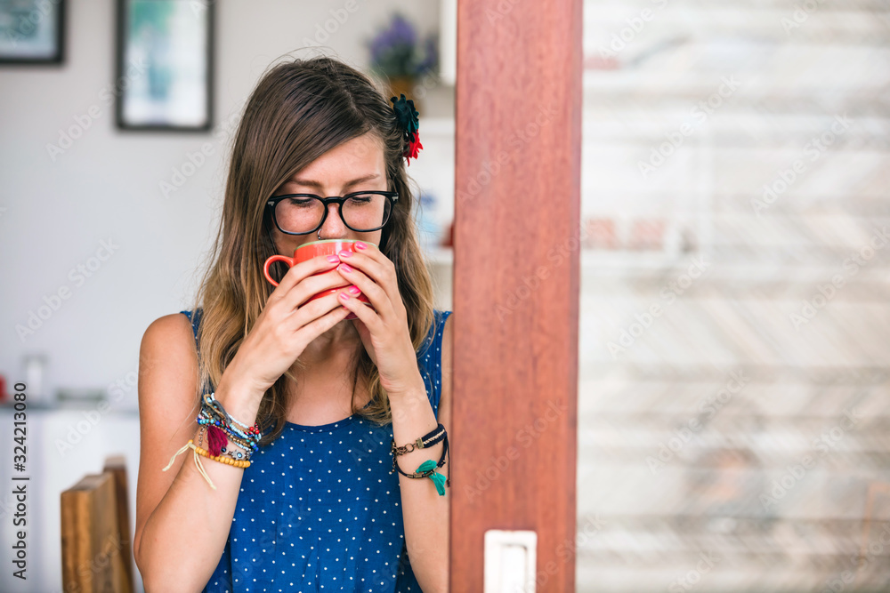 Woman enjoying coffee / tea at home. Woman enjoying coffee / tea at home.