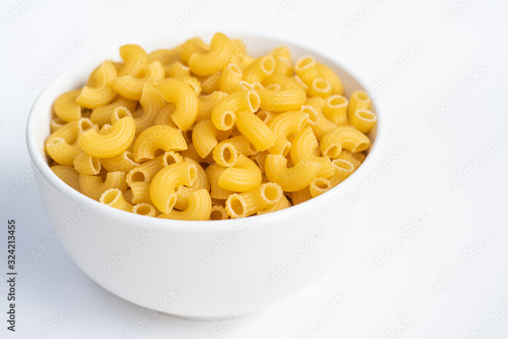 Raw macaroni in a bowl. Raw macaroni in a bowl.