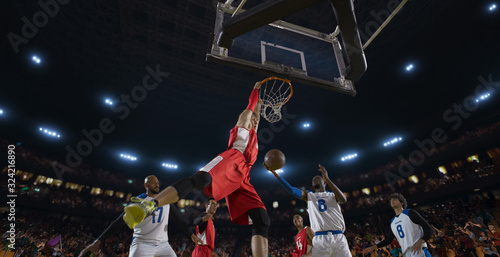 Basketball players on big professional arena during the game. Tense moment of the game. View from below the basket © haizon