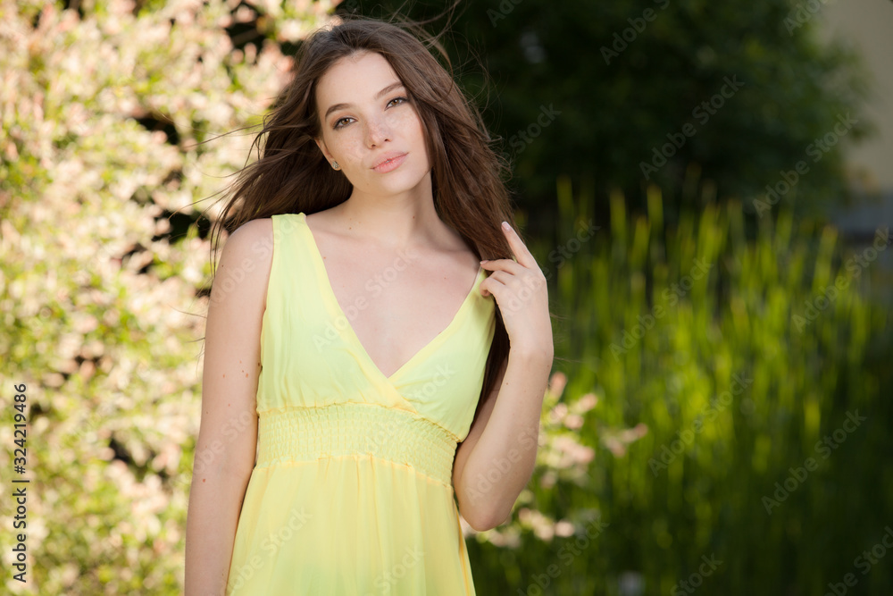 Portrait of beautiful young girl in summer garden. Portrait of beautiful young girl in summer garden.