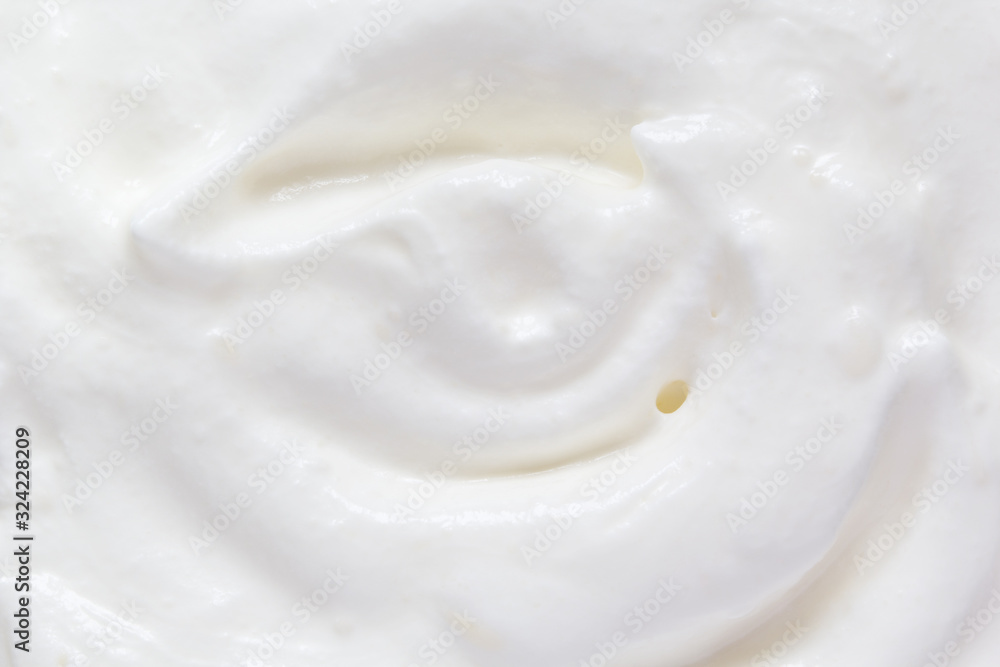 Whipped cream swirl texture. White soft dairy product. Cooking food background. Top view Whipped cream swirl texture. White soft dairy product. Cooking food background. Top view