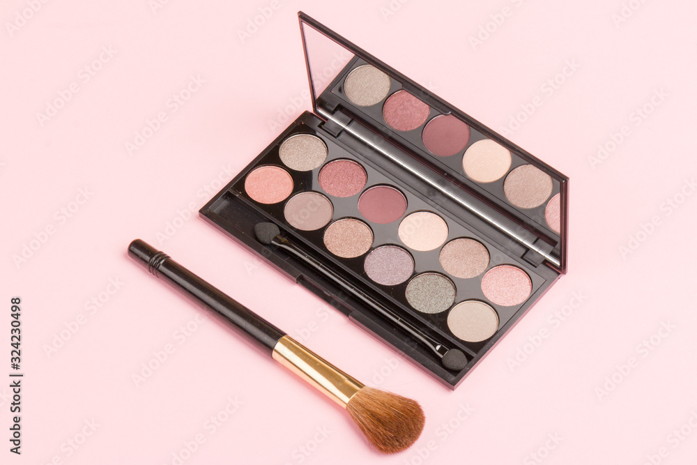 set of pastel eyeshadows isolated on rose background set of pastel eyeshadows isolated on rose background