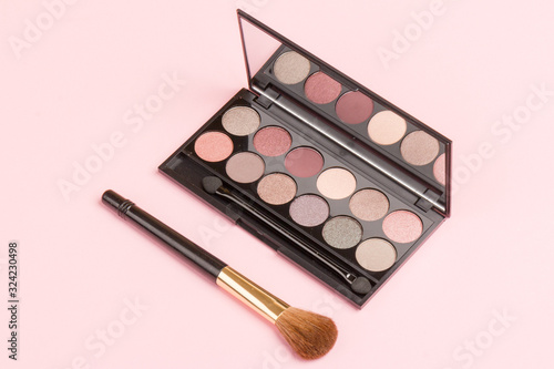 set of pastel eyeshadows isolated on rose background