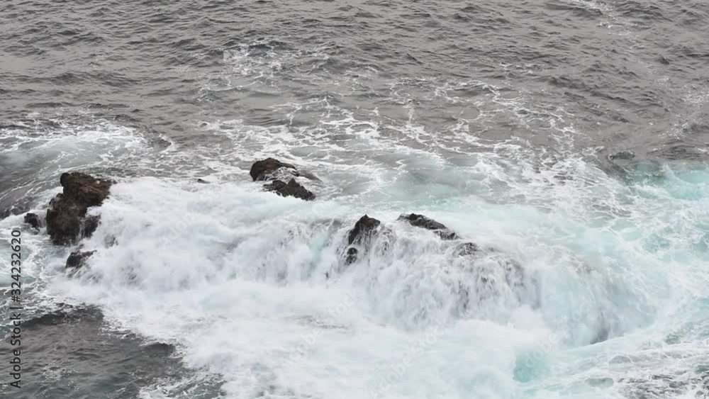 Waves crashing on rock in the Atlantic Ocean Waves crashing on rock in the Atlantic Ocean