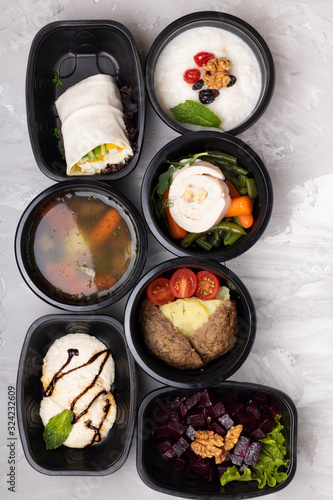 Healthy food in seven boxes. Breakfast, lunch and dinner, meal day plan. Vertical food