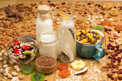Muesli balanced protein breakfast. Fruits, berries  seeds, nuts. Coconut beverage and yogurt © 201122