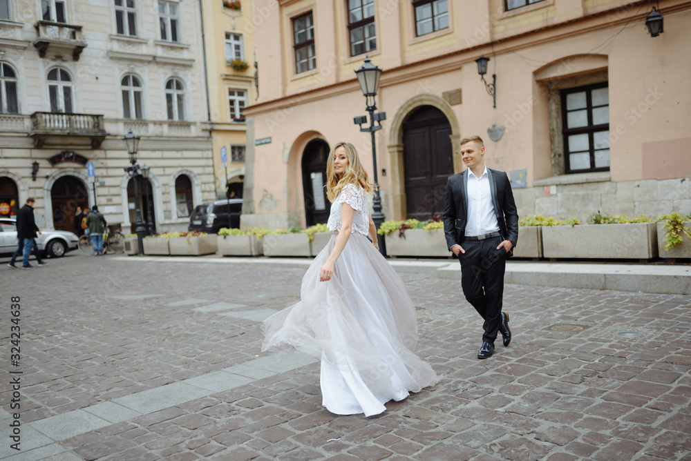 Two lovers walk along Krakow