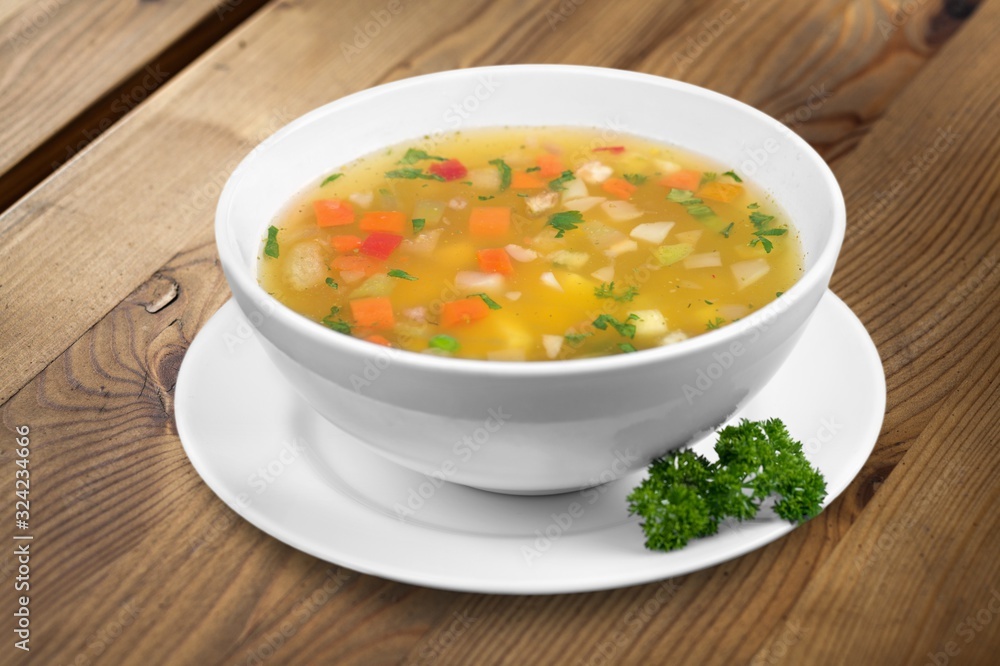Bowl of delicious vegetable soup on a table Bowl of delicious vegetable soup on a table
