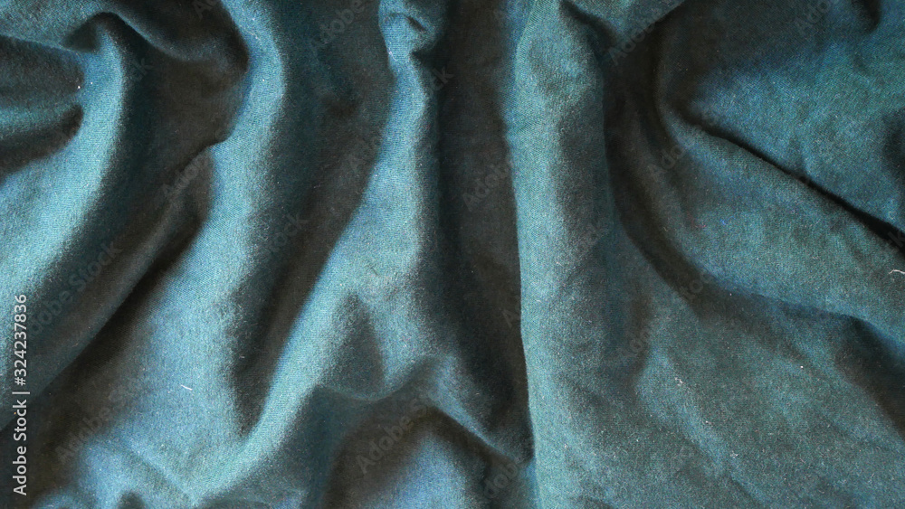 texture of silk fabric. green cotton satin background texture of silk fabric. green cotton satin background