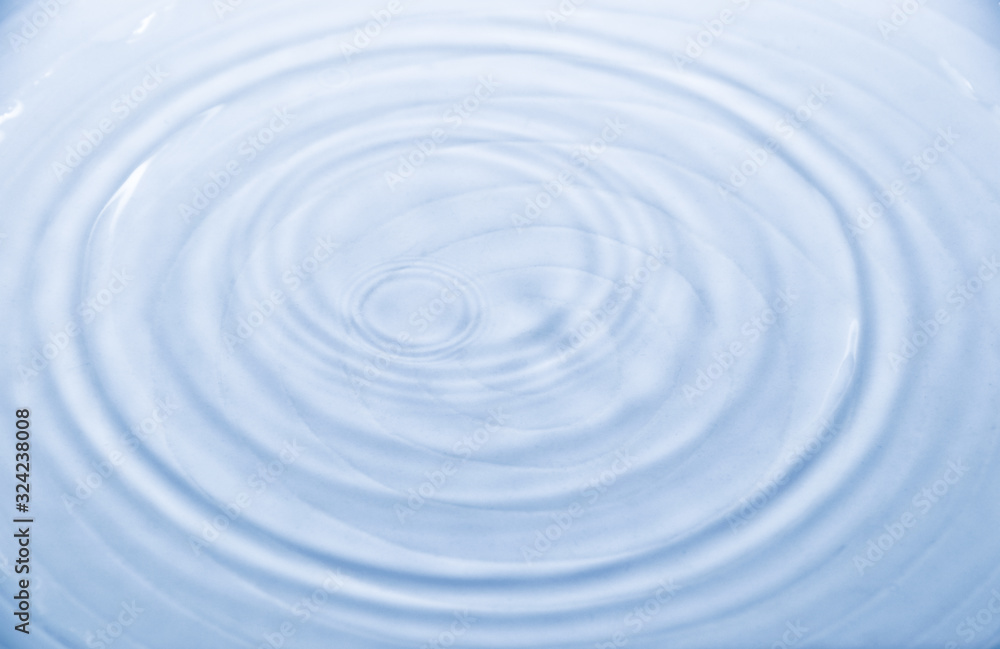 Water wave splash in white ceramic bowl                    