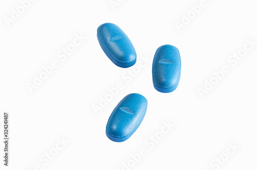 View of three blue Pills on White background