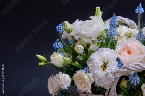 Bouquet. Composition of fresh, delicate flowers on a dark background.