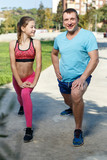 Father and preteen girl training together