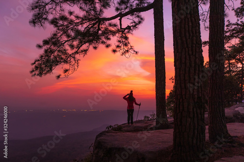 Young girl traveling on the high mountain at Phu-kra-dueng national park Loei province, Thailand.