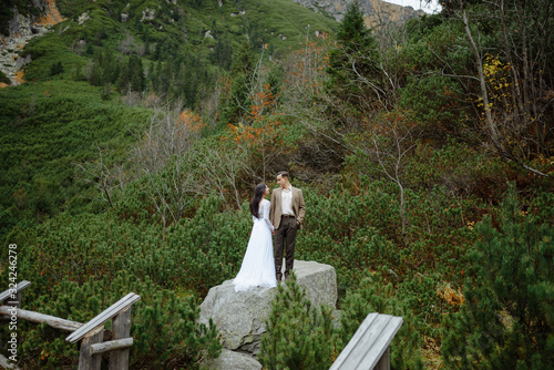 Beautiful couple walking among rocks