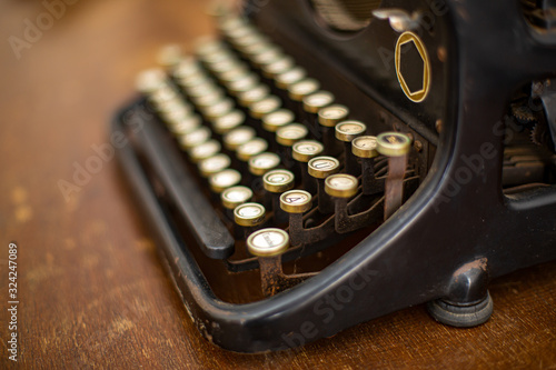 Details of the keys of an old typewriter with frontfocus and blurry background photo