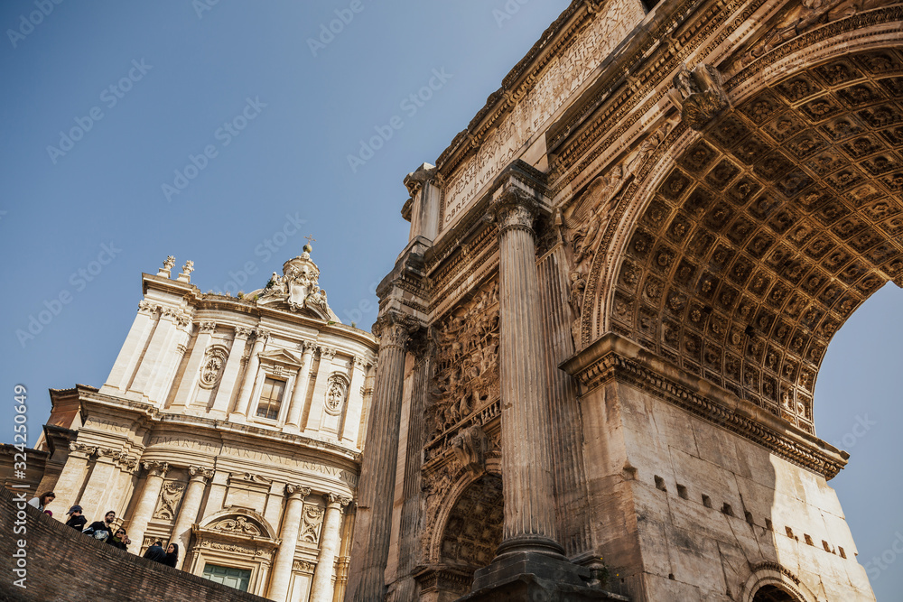 ROME, ITALY - MARCH 03, 2019:  Ruins of Roman forum in springtime. Ancient government buildings , temple and shrine of Roman empire. 