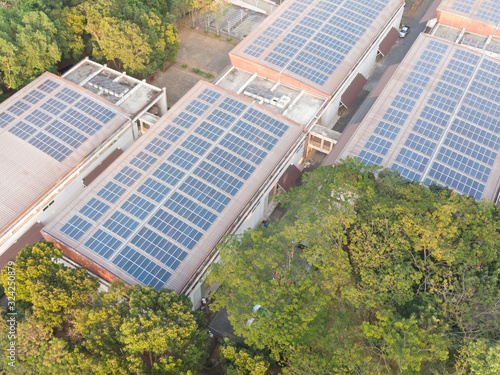 Aerial view photo of solar panels.solar panels absorb sunlight to generate electricity. Solar Power Station renewable energy on rooftop