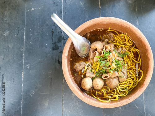 Top view Beef noodles in a clay bowl Top with meat and meat ball. For eating as lunch