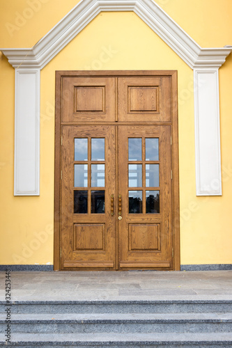 closed wooden door with glass inserts