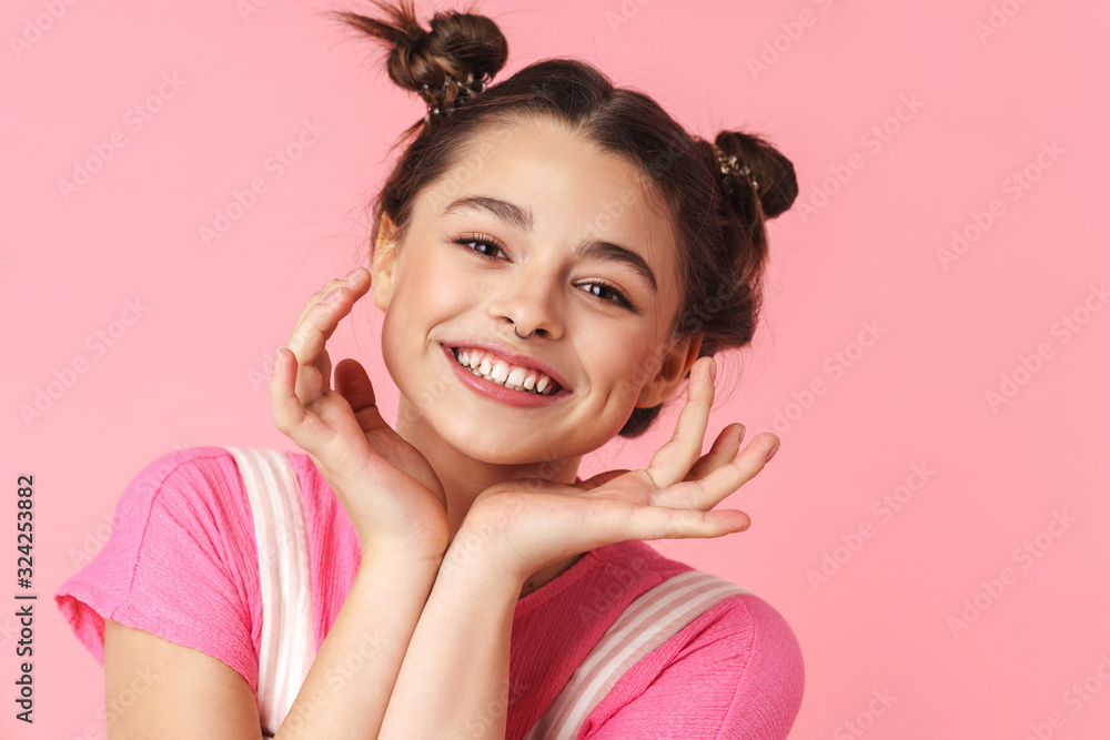 Photo of lovely charming girl posing and smiling at camera Photo of lovely charming girl posing and smiling at camera