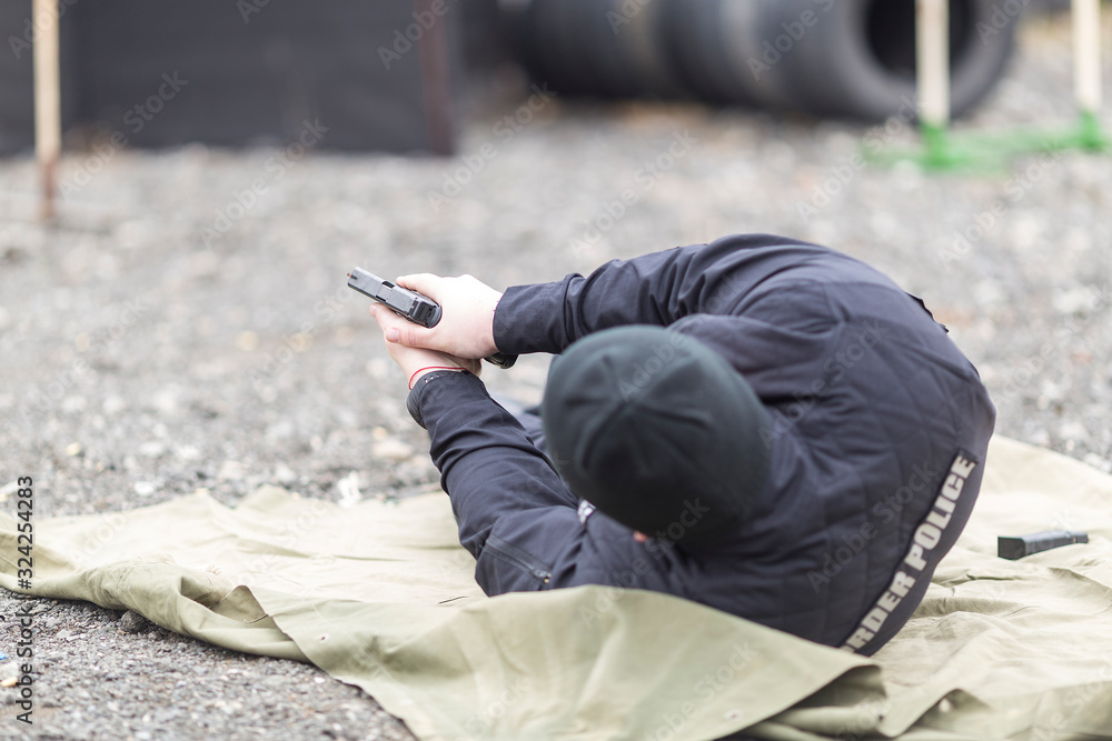 police, army and border police gun training. firing weapons and pistols. gun shooting exercise. detailed shots of gun, bullets and shells. police, army and border police gun training. firing weapons and pistols. gun shooting exercise. detailed shots of gun, bullets and shells.