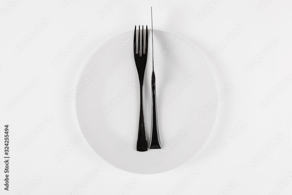 White ceramic round plate isolated on white. Excellent food concept.