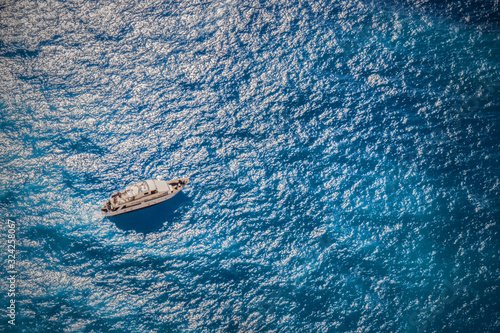 A luxury yacht cruise in the blue, turquoise waters of the wavy Ionian sea in Zante, Zakynthos, Greece
