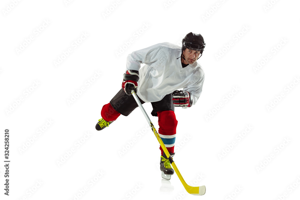 Obraz premium Speed. Young male hockey player with the stick on ice court and white background. Sportsman wearing equipment and helmet practicing. Concept of sport, healthy lifestyle, motion, movement, action.