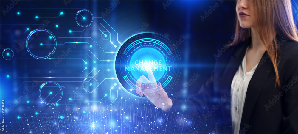 Business, Technology, Internet and network concept. Young businessman working on a virtual screen of the future and sees the inscription: Change management Business, Technology, Internet and network concept. Young businessman working on a virtual screen of the future and sees the inscription: Change management
