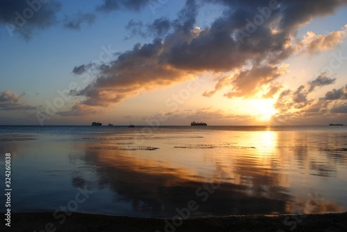 Stunning sunset and gorgeous clouds reflected in the lagoon of Saipan  Northern Mariana Islands.