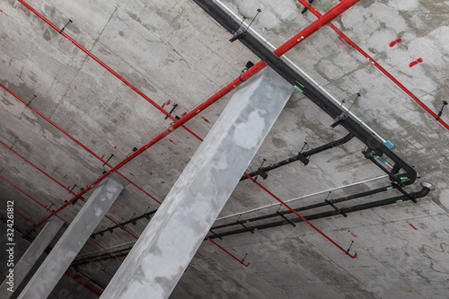 Fire protection system installation on bare skin ceiling.