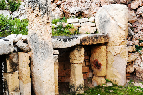 Neolithic limestone gate at the ggantija temples complex in Xaghra in island of Gozo, Malta photo