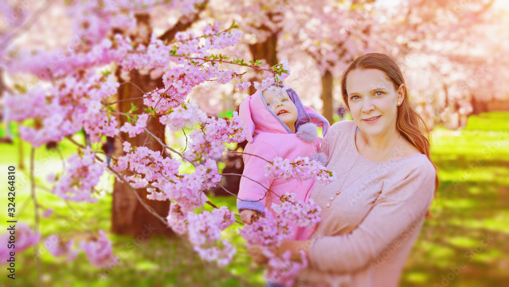 mother and the girl in the nature - trees on the flower mother and the girl in the nature - trees on the flower