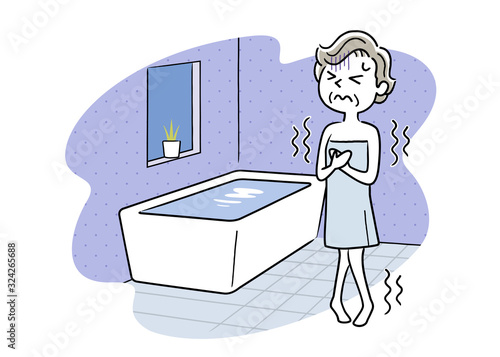 Senior woman shivering in cold bathroom