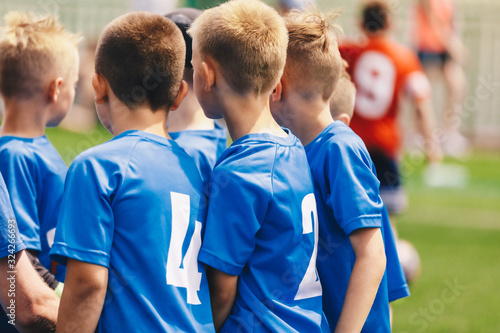 Kids Play Sports. Children Sports Team United Ready to Play Game. Children Team Sport. Youth Sports For Children. Boys in Sports Blue Uniforms. Young Boys in Soccer Jersey Sportswear © matimix