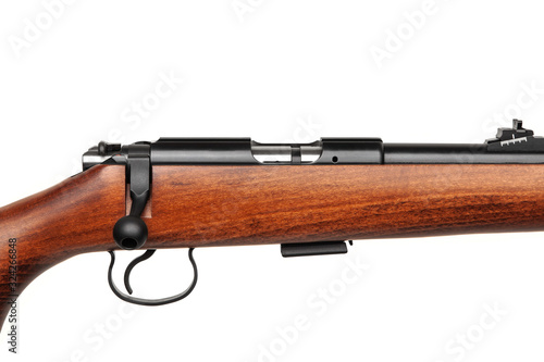 Small-bore rifle .22 lr isolated on white background. Modern .22lr semi-automatic rifle with a wooden butt on a white back. Weapons for hunting sports and self-defense.